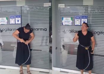 Madre se encadena en farmacia de Riohacha en señal de protesta por insumo vital para su hijo hospitalizado